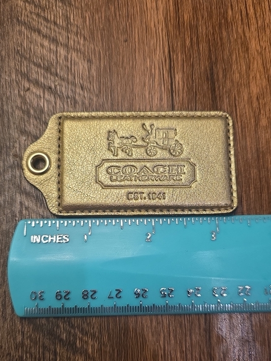 Coach Accessories - Coach Authentic Metallic Gold Leather Hangtag